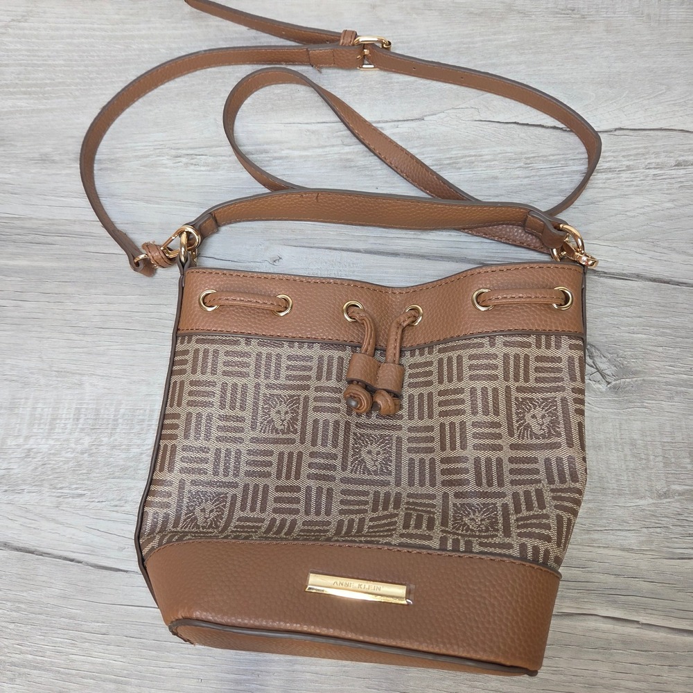 Anne Klein Brown Monogram Lion Logo Bucket Bag Crossbody Drawstring Tassel